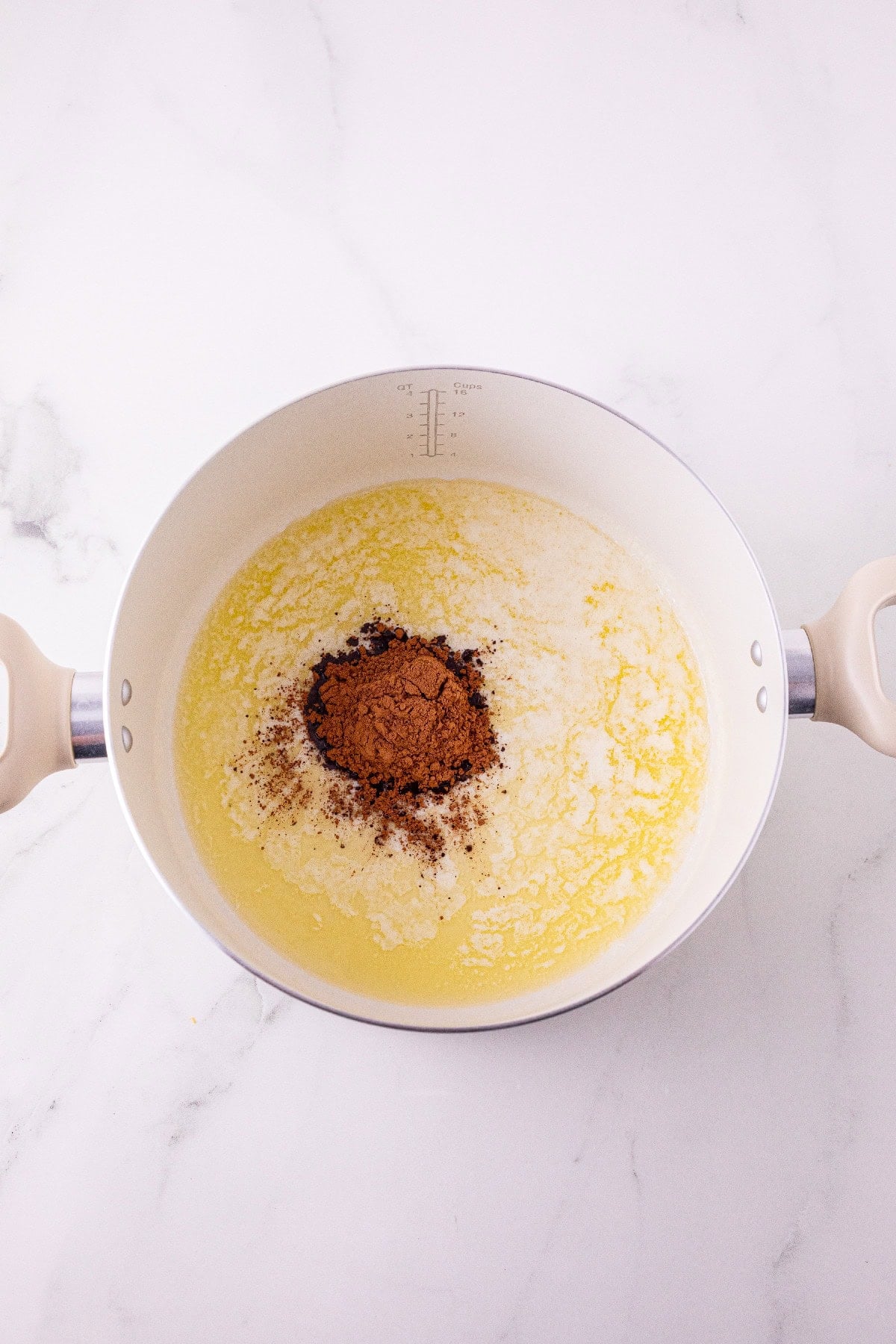 Cocoa powder added to melted butter.