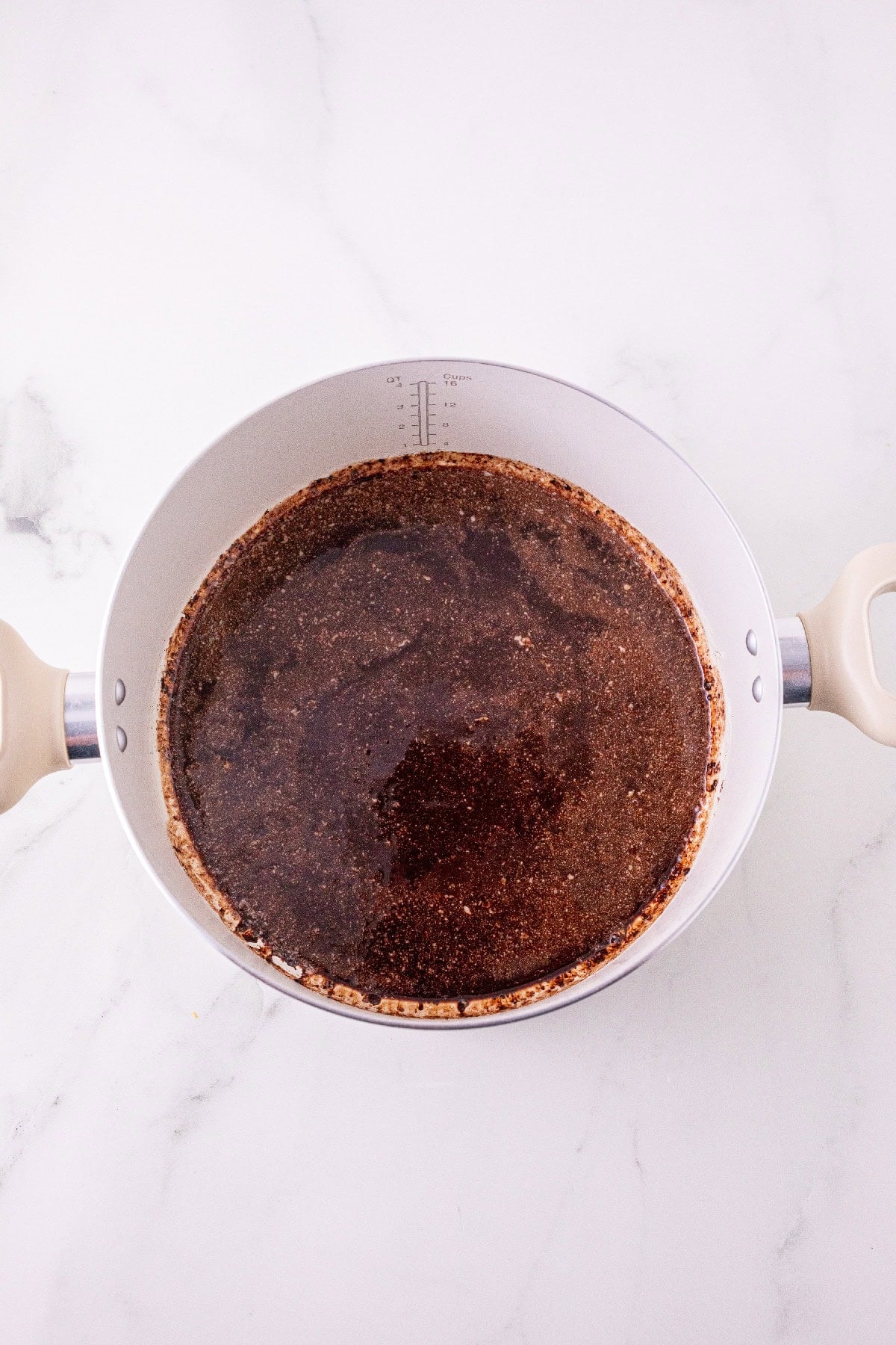 Cocoa powder stirred into melted butter.