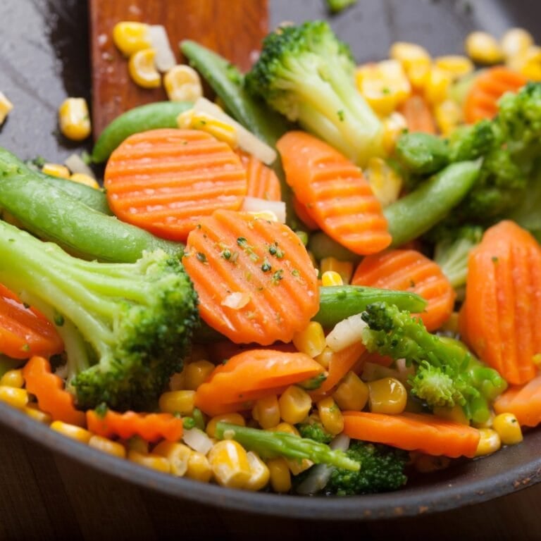 Sautéed vegetables with broccoli, carrots, peas, and corn.