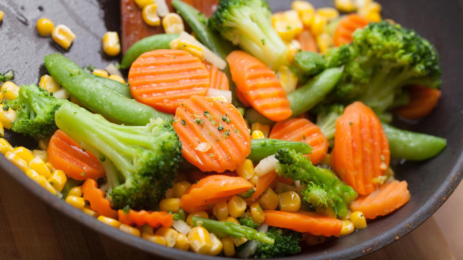 Sautéed mixed vegetables with broccoli, carrots, peas, and corn.