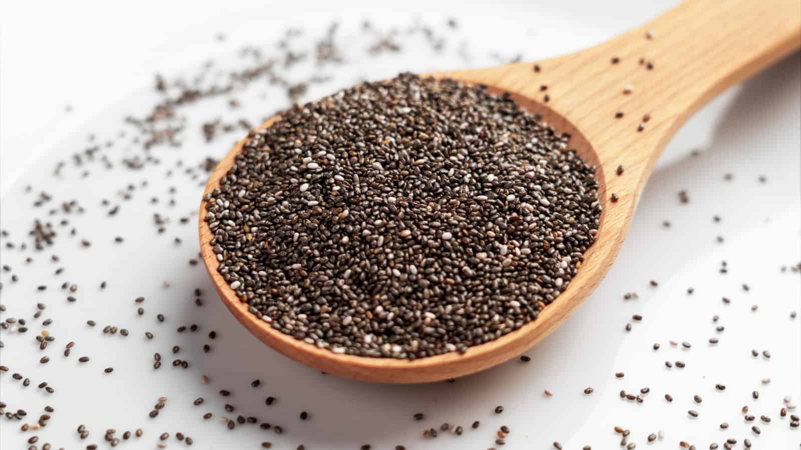 Chia seeds in a wooden spoon.