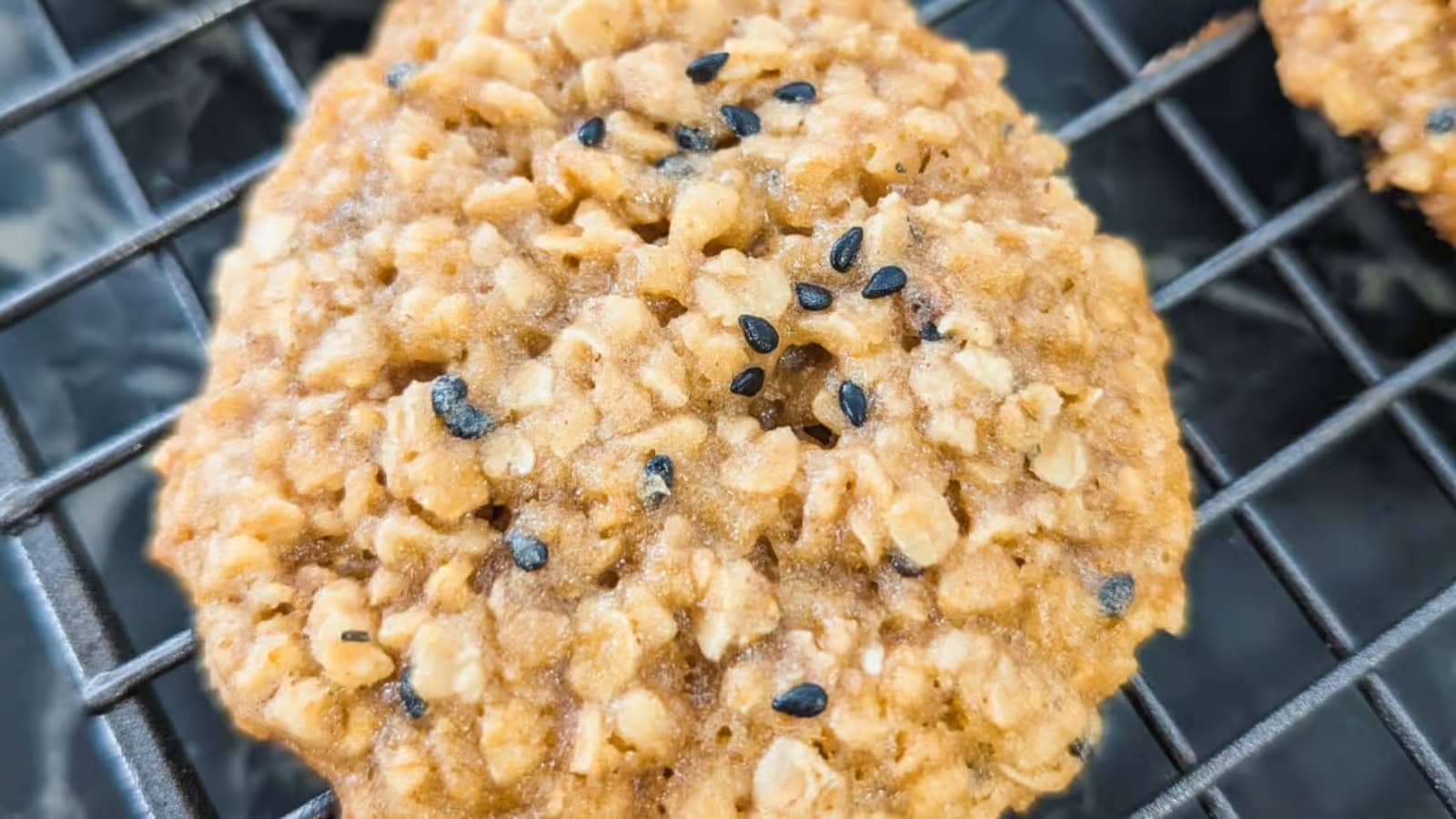 Spiced oatmeal cookies sprinkled with black sesame seeds.