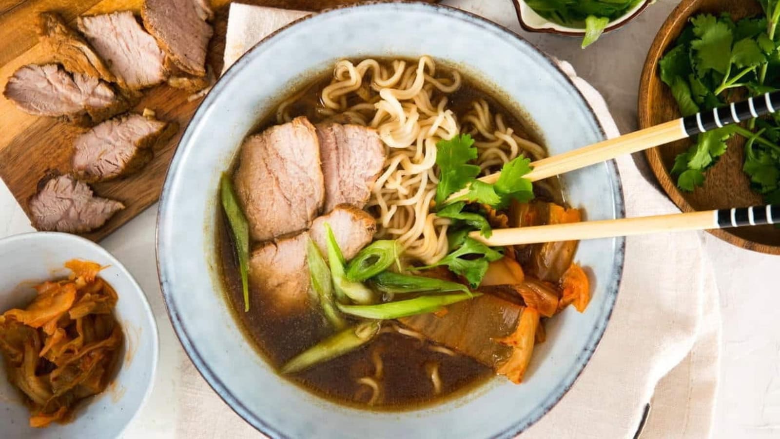 Ramen noodles served in a spicy broth with kimchi and savory toppings.