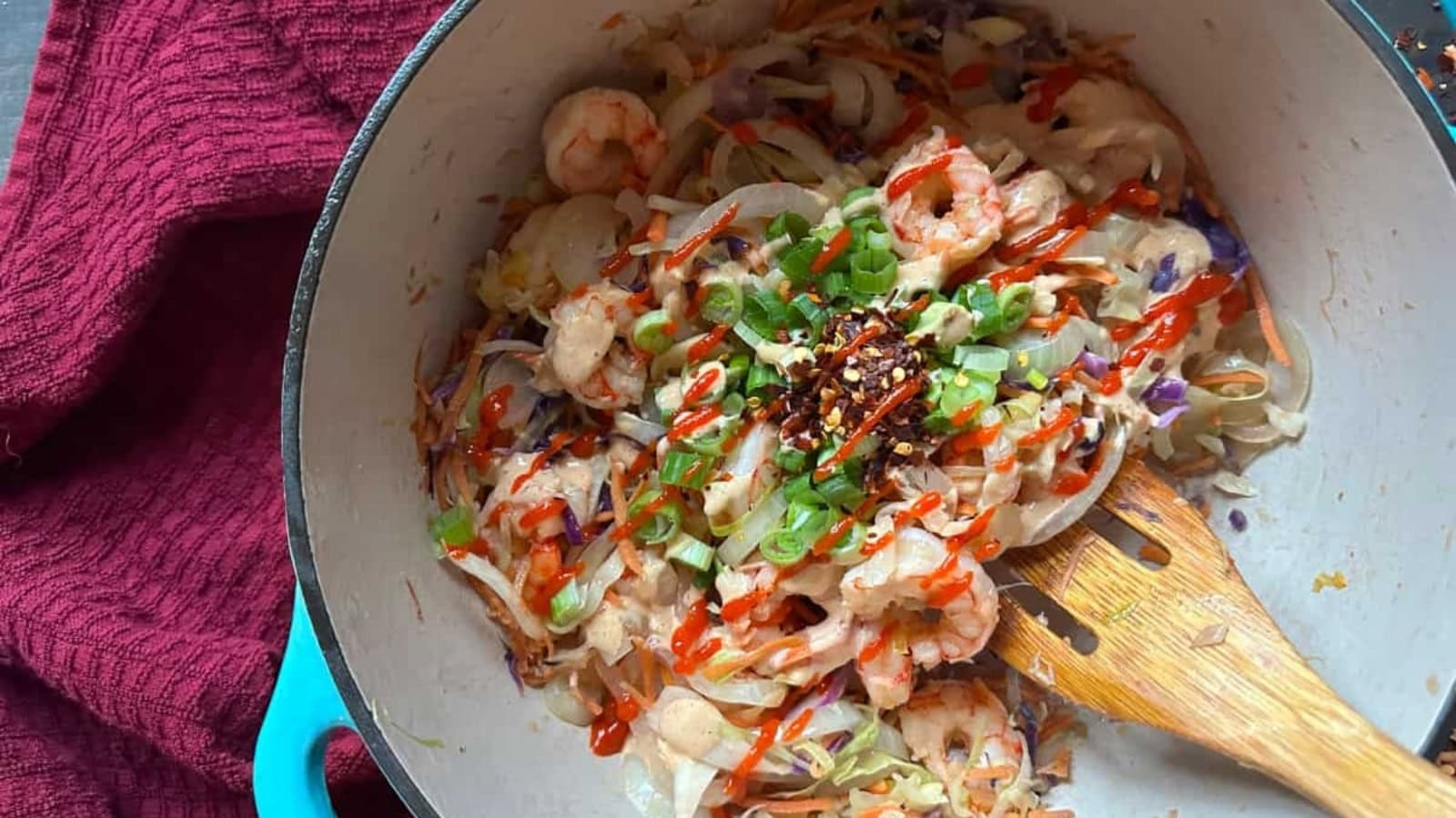 Deconstructed egg roll bowl with shrimp, cabbage, and savory seasonings.