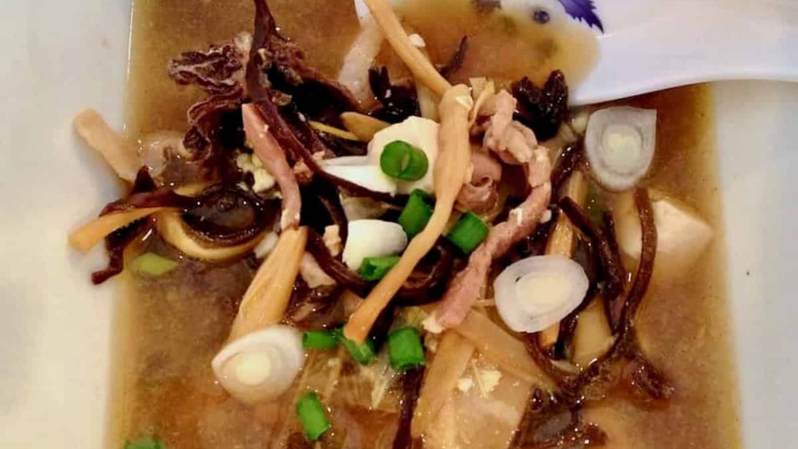 Spicy and tangy hot and sour soup filled with vegetables and savory ingredients.