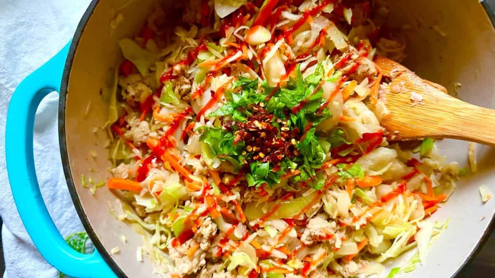 Deconstructed egg rolls with seasoned ground meat and crunchy vegetables.